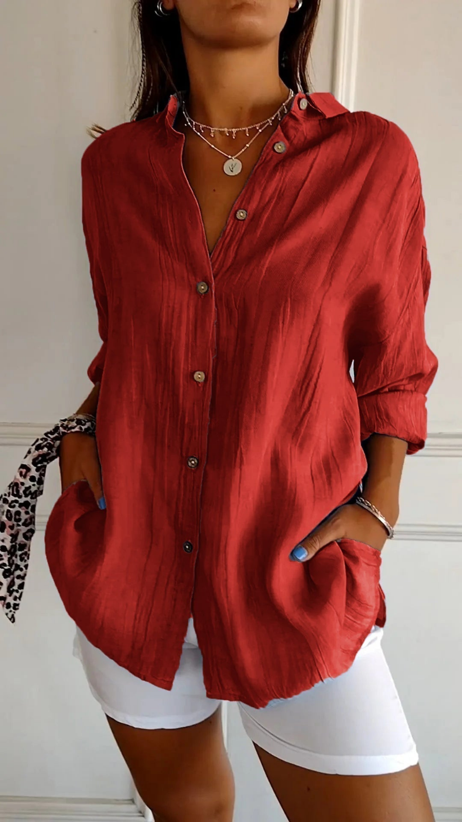 Women's oversized button-down shirt with pointed collar and rolled sleeves
