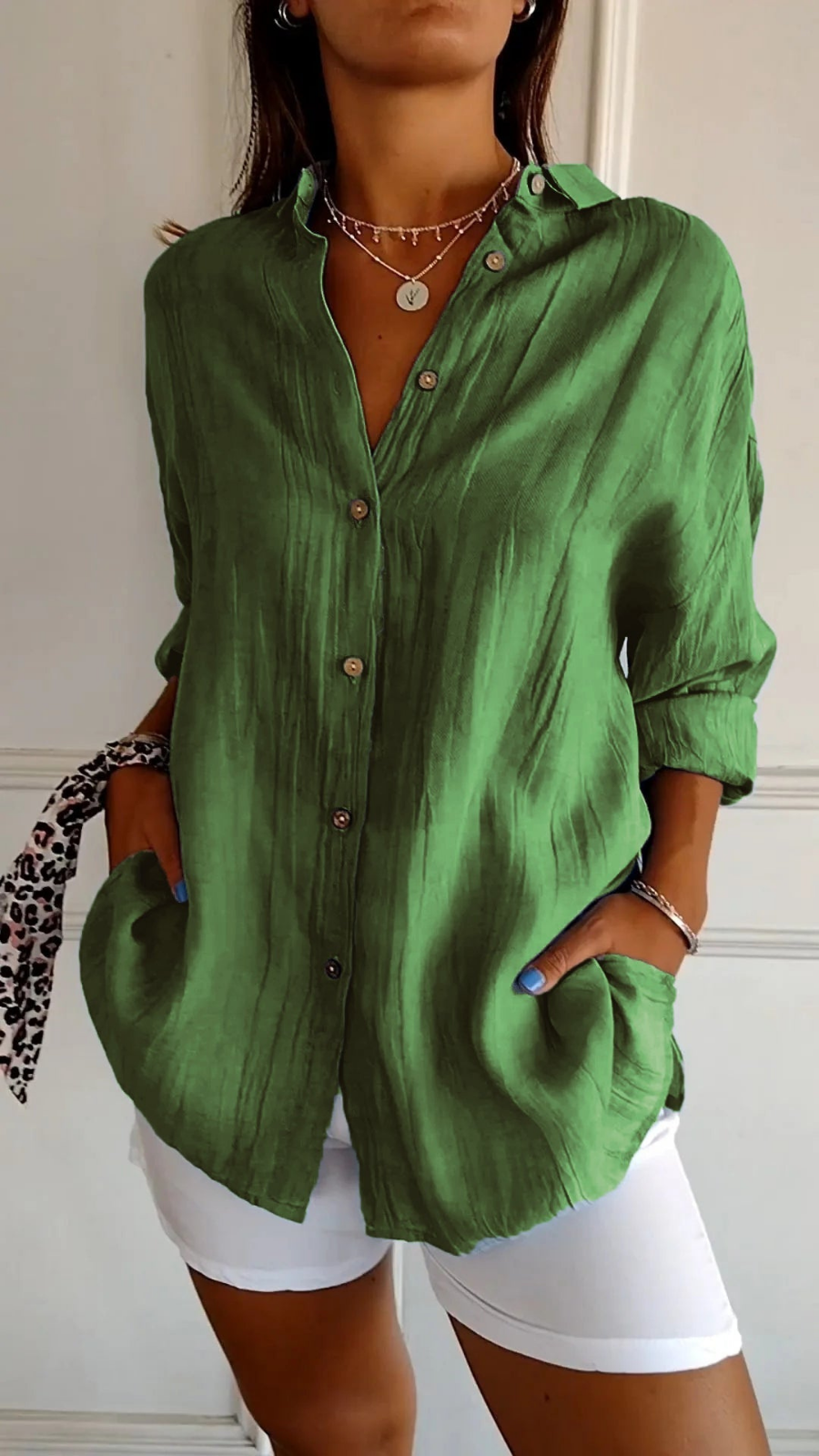 Women's oversized button-down shirt with pointed collar and rolled sleeves