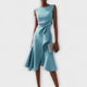 Women's sleeveless draped midi dress with defined waist tie and flared skirt