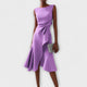 Women's sleeveless draped midi dress with defined waist tie and flared skirt