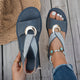 Women's open-toe sandals with crossed straps and circular centre detail