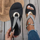 Women's open-toe sandals with crossed straps and circular centre detail