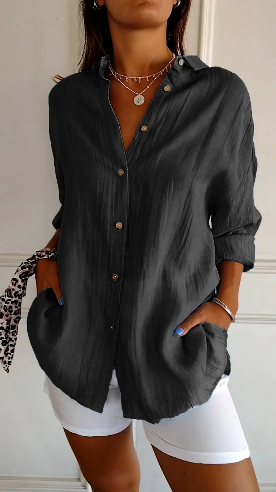 Women's oversized button-down shirt with pointed collar and rolled sleeves