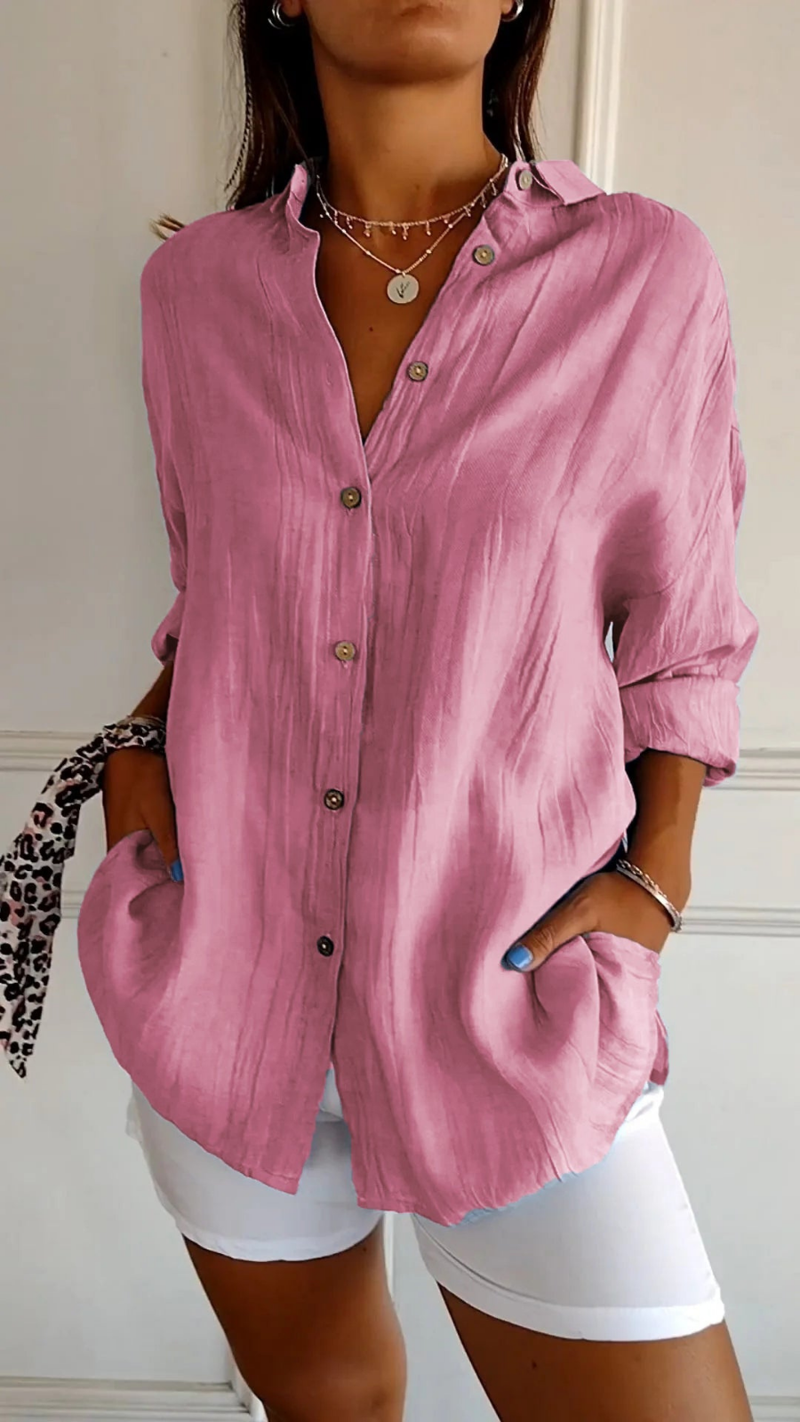 Women's oversized button-down shirt with pointed collar and rolled sleeves
