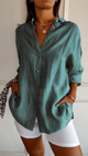 Women's oversized button-down shirt with pointed collar and rolled sleeves