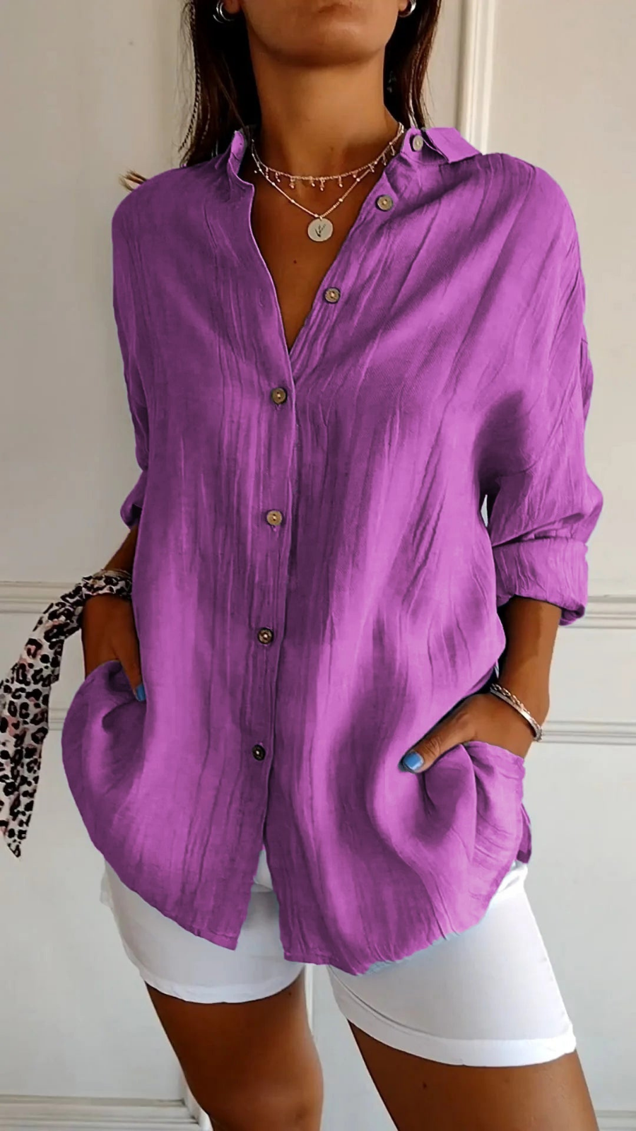 Women's oversized button-down shirt with pointed collar and rolled sleeves