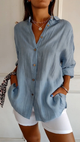 Women's oversized button-down shirt with pointed collar and rolled sleeves