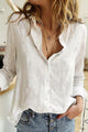 Women's button-down blouse with V-neck collar and long sleeves