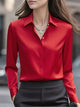Women's collared blouse with long sleeves and button front