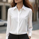 Women's collared blouse with long sleeves and button front