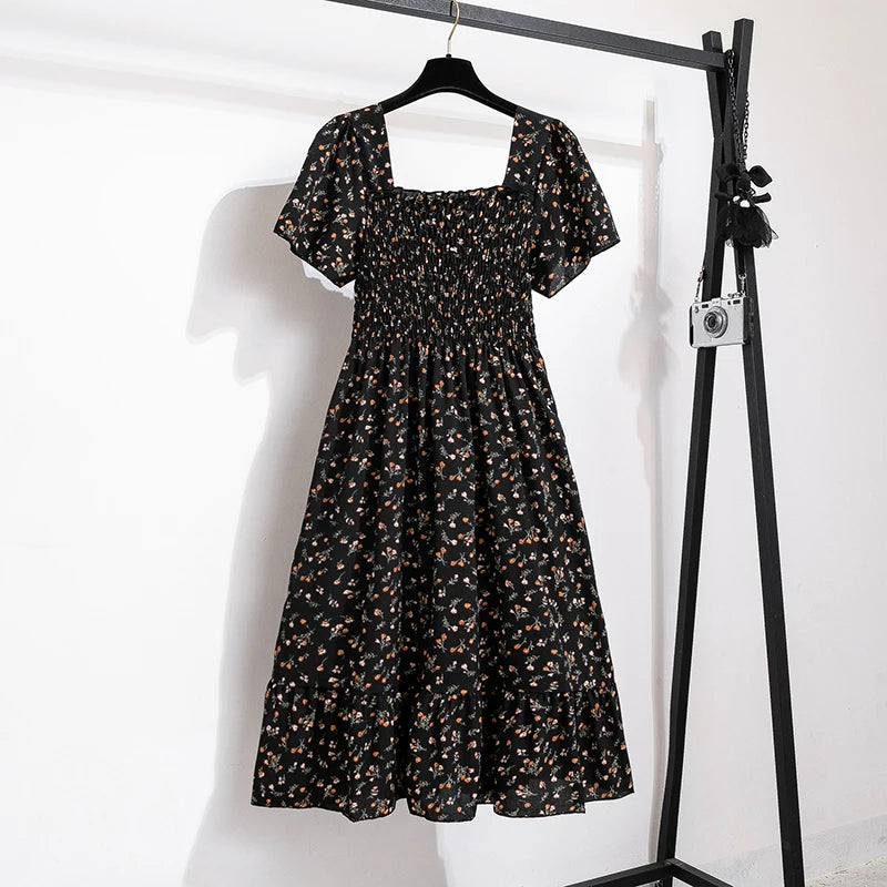 Thea smocked floral midi dress with flutter sleeves in black floral