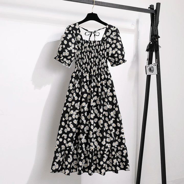 Rosaria smocked floral midi dress with puff sleeves in black daisy