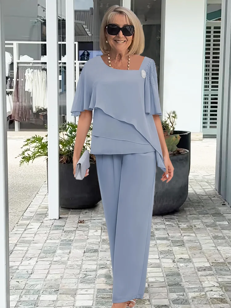 Women's two-piece set with layered short-sleeve top and wide-leg trousers