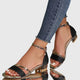 Women's open-toe ankle-strap sandals with metallic trim and low heel