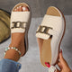 Women's white buckle slide sandals with open toe and flat sole