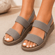 Women's open-toe walking sandals with three wide textured straps and flat soles